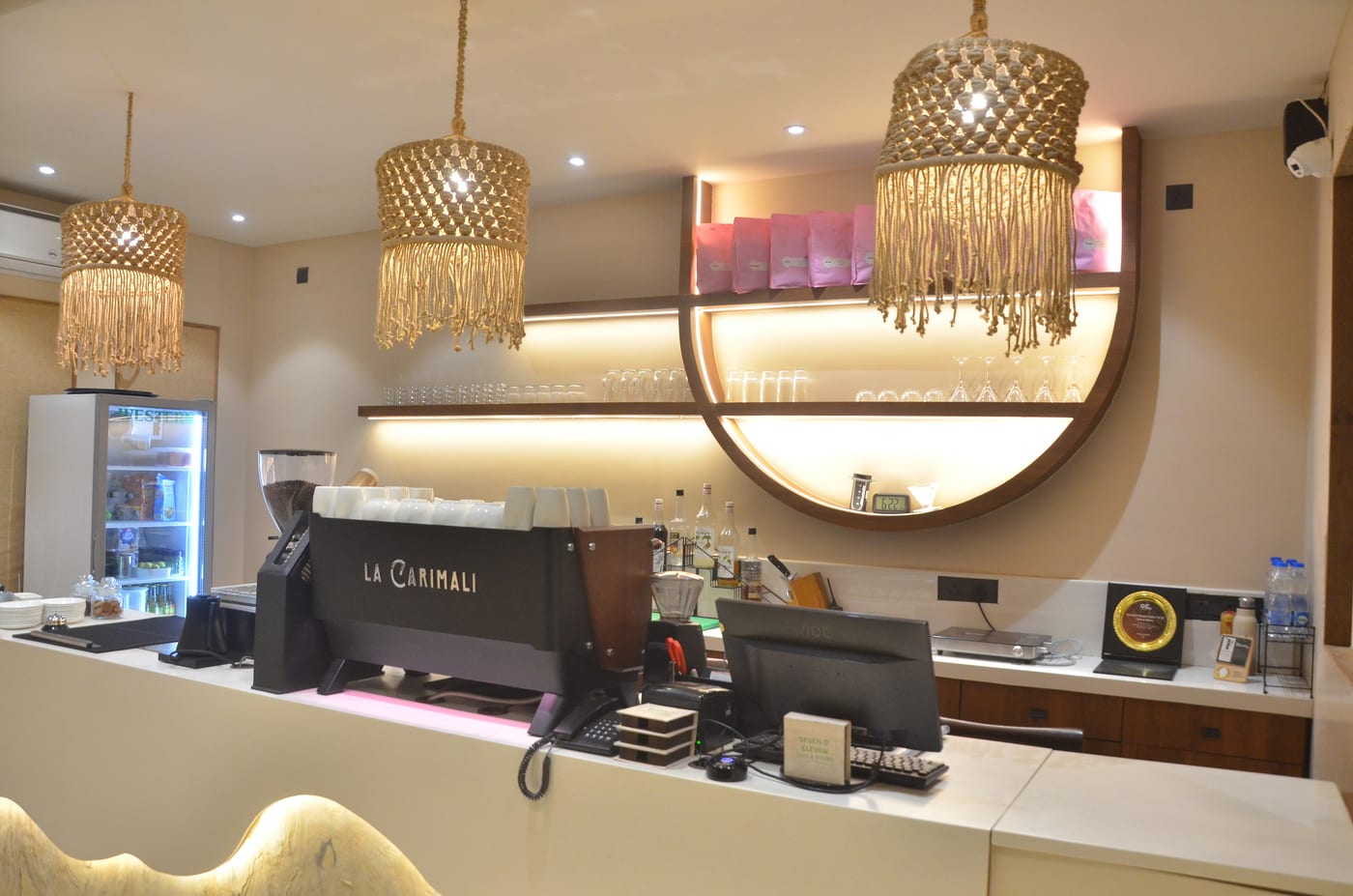 Coffee bar with espresso machine and macramé pendant lights